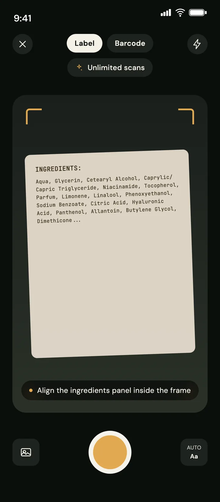 Ingreview scan screen in dark theme: the camera framing a product's ingredients panel, with label and barcode modes and an unlimited-scans badge.
